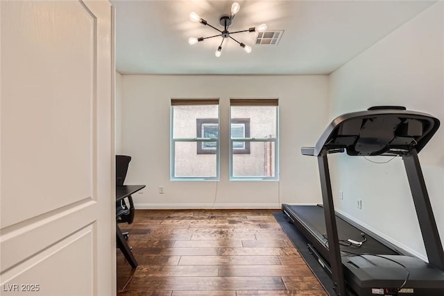 529 Caribbean Palm Dr, Las Vegas, NV 89138 - exercise room featuring a chandelier, dark wood-style floors, and baseboards