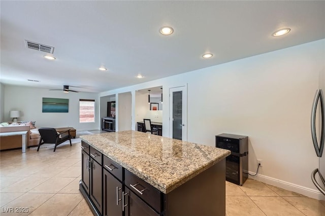 529 Caribbean Palm Dr, Las Vegas, NV 89138 - kitchen with a center island, light tile patterned flooring, recessed lighting, light stone countertops, and ceiling fan