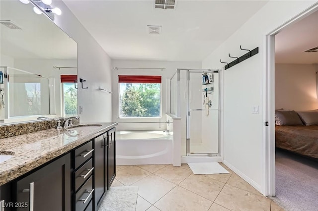 529 Caribbean Palm Dr, Las Vegas, NV 89138 - full bath featuring ensuite bathroom, a garden tub, a shower stall, tile patterned flooring, and double vanity