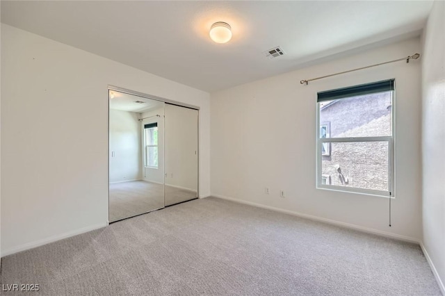 529 Caribbean Palm Dr, Las Vegas, NV 89138 - unfurnished bedroom featuring light colored carpet, baseboards, and a closet
