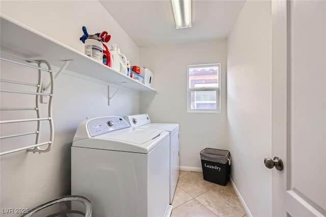 529 Caribbean Palm Dr, Las Vegas, NV 89138 - laundry area featuring washing machine and dryer, light tile patterned flooring, and baseboards
