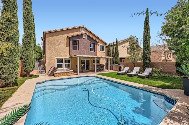 529 Caribbean Palm Dr, Las Vegas, NV 89138 - view of pool featuring a hot tub, a fenced backyard, and a patio area