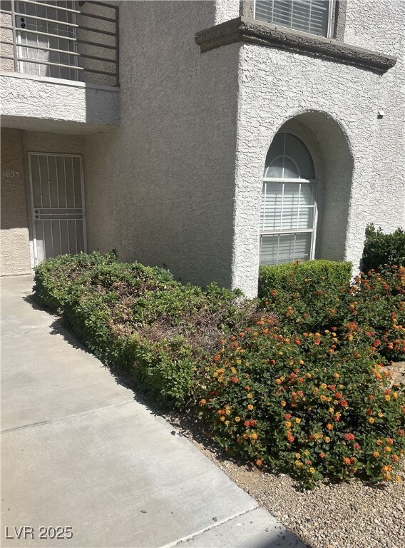 3150 Soft Breezes Dr Unit 1033, Las Vegas, NV 89128 - view of home's exterior with stucco siding