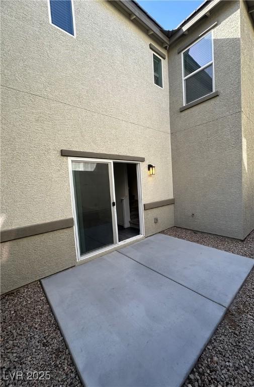 12170 Midnight Pine Rd Unit 3, Las Vegas, NV 89183 - back of property with a patio and stucco siding
