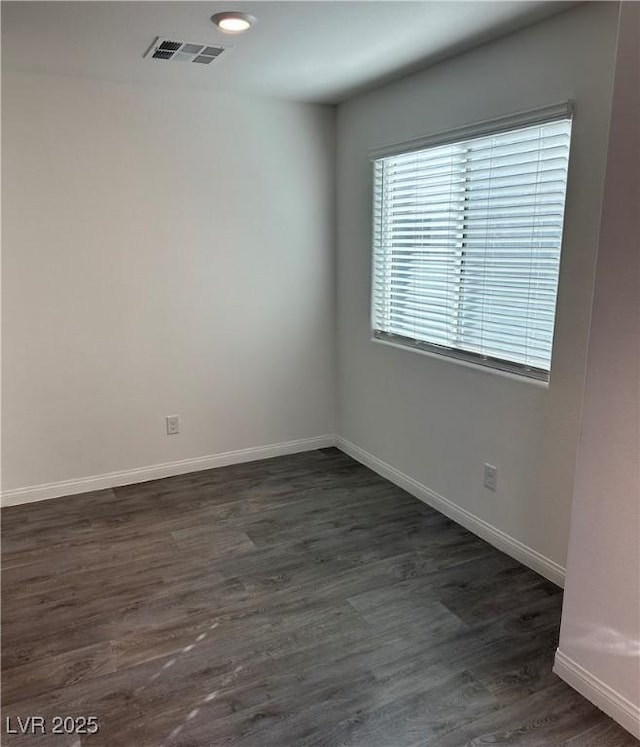12170 Midnight Pine Rd Unit 3, Las Vegas, NV 89183 - empty room with baseboards and dark wood-style floors