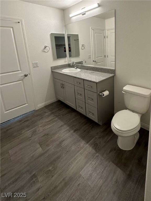 12170 Midnight Pine Rd Unit 3, Las Vegas, NV 89183 - bathroom featuring vanity, wood finished floors, and baseboards