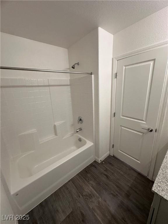 12170 Midnight Pine Rd Unit 3, Las Vegas, NV 89183 - bathroom with wood finished floors, shower / bathtub combination, vanity, and baseboards