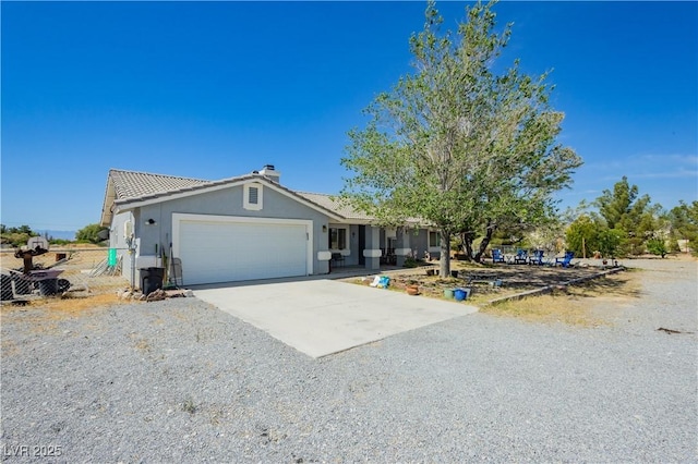 2251 Bridger St, Pahrump, NV 89048 - single story home featuring concrete driveway, a garage, a chimney, and stucco siding