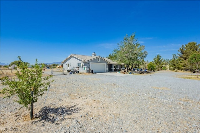 2251 Bridger St, Pahrump, NV 89048 - view of front of home with a garage and concrete driveway
