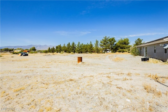 2251 Bridger St, Pahrump, NV 89048 - view of yard with a mountain view