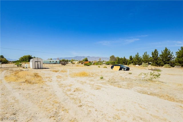 2251 Bridger St, Pahrump, NV 89048 - view of yard with a view of countryside and a mountain view