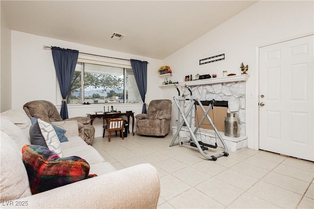 2251 Bridger St, Pahrump, NV 89048 - living area featuring vaulted ceiling, tile patterned floors, and a fireplace