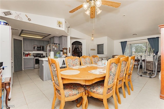 2251 Bridger St, Pahrump, NV 89048 - dining space with vaulted ceiling, light tile patterned floors, and a ceiling fan