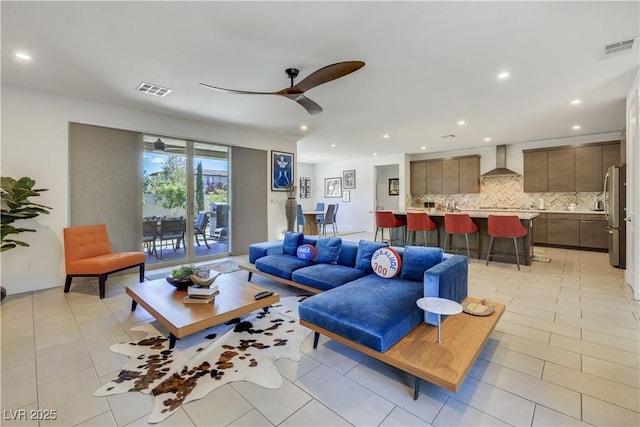 10297 Sierra Skye Ave, Las Vegas, NV 89166 - living area featuring a ceiling fan, recessed lighting, and light tile patterned floors