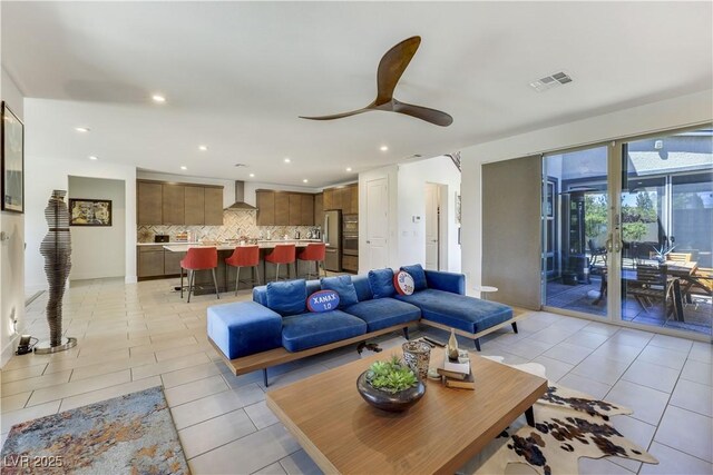 10297 Sierra Skye Ave, Las Vegas, NV 89166 - living area featuring light tile patterned floors, ceiling fan, and recessed lighting