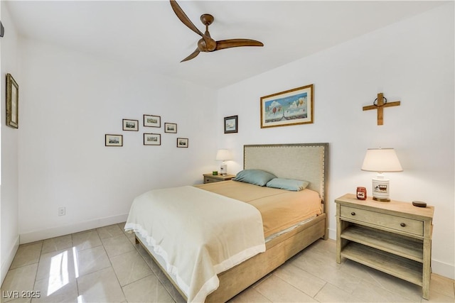 10297 Sierra Skye Ave, Las Vegas, NV 89166 - bedroom with baseboards, a ceiling fan, and light tile patterned floors