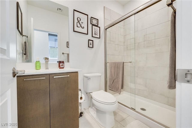 10297 Sierra Skye Ave, Las Vegas, NV 89166 - bathroom featuring toilet, vanity, a stall shower, and tile patterned floors