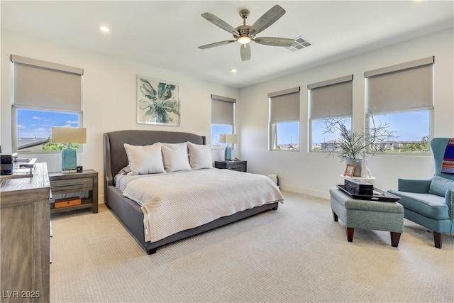 10297 Sierra Skye Ave, Las Vegas, NV 89166 - bedroom featuring multiple windows, light carpet, recessed lighting, and baseboards