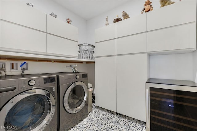 10297 Sierra Skye Ave, Las Vegas, NV 89166 - laundry area featuring beverage cooler, independent washer and dryer, cabinet space, and light tile patterned floors