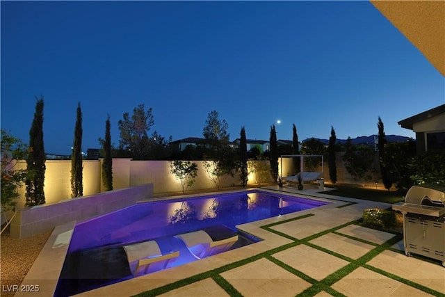 10297 Sierra Skye Ave, Las Vegas, NV 89166 - view of swimming pool with grilling area, a fenced backyard, and a patio area