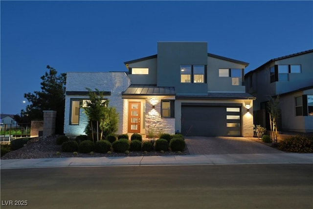 10297 Sierra Skye Ave, Las Vegas, NV 89166 - contemporary house featuring a standing seam roof, an attached garage, driveway, stone siding, and metal roof