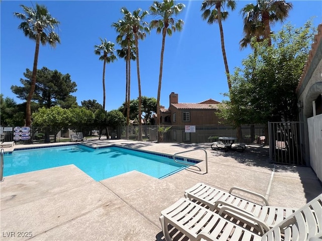 5260 Mission Monterey Ln Unit 208, Las Vegas, NV 89107 - community pool featuring a patio