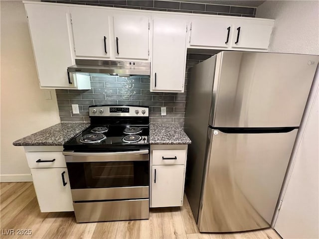 5260 Mission Monterey Ln Unit 208, Las Vegas, NV 89107 - kitchen with appliances with stainless steel finishes, under cabinet range hood, light wood-style floors, and white cabinets