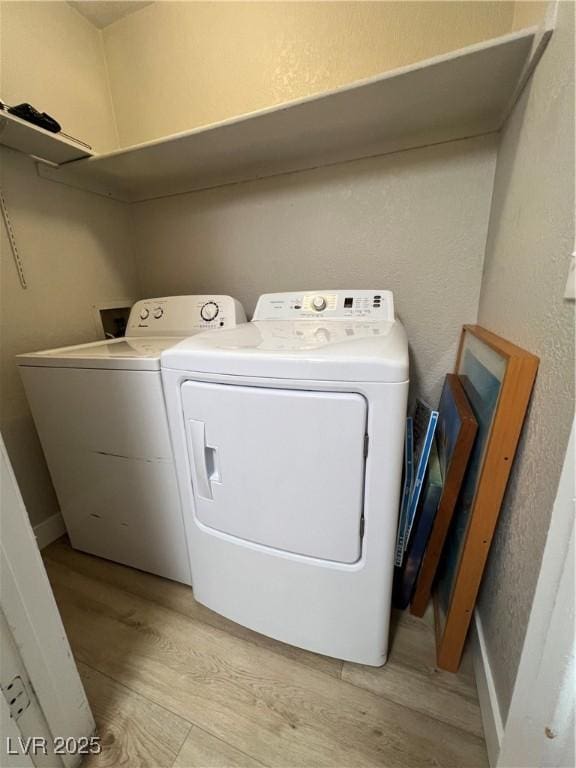5260 Mission Monterey Ln Unit 208, Las Vegas, NV 89107 - laundry area with independent washer and dryer and light wood finished floors