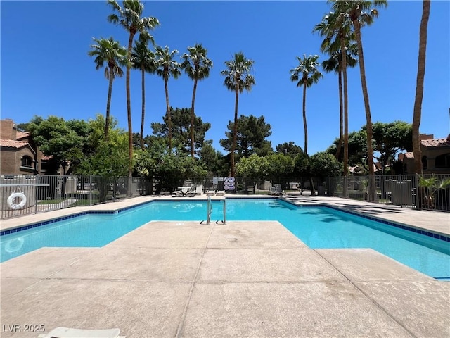 5260 Mission Monterey Ln Unit 208, Las Vegas, NV 89107 - community pool featuring a patio
