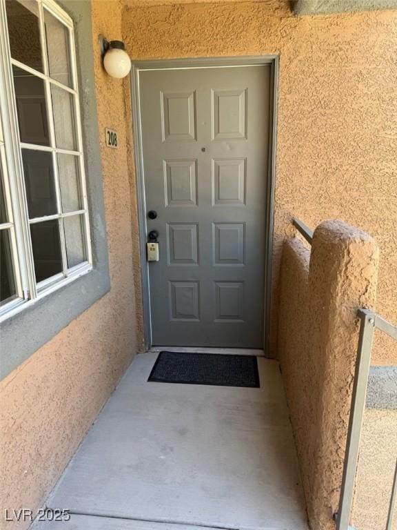 5260 Mission Monterey Ln Unit 208, Las Vegas, NV 89107 - view of exterior entry featuring stucco siding