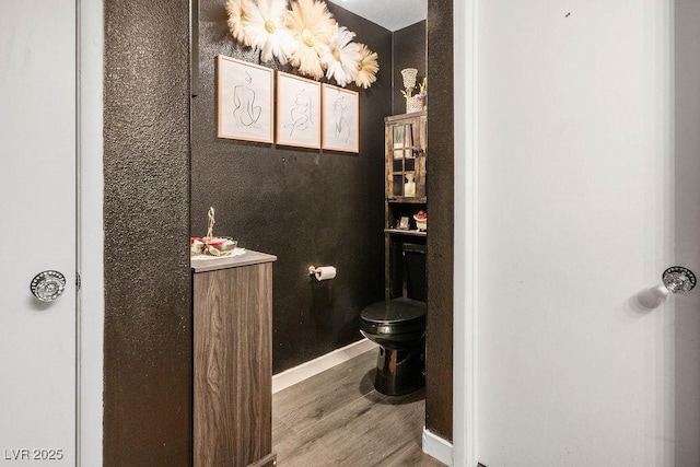 8884 Perfect Diamond Ct, Las Vegas, NV 89129 - bathroom featuring toilet, wood finished floors, and baseboards