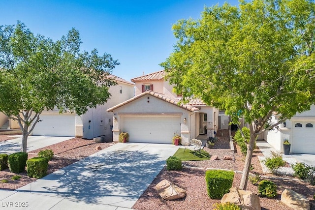 8884 Perfect Diamond Ct, Las Vegas, NV 89129 - mediterranean / spanish-style home featuring a tiled roof, stucco siding, concrete driveway, and an attached garage