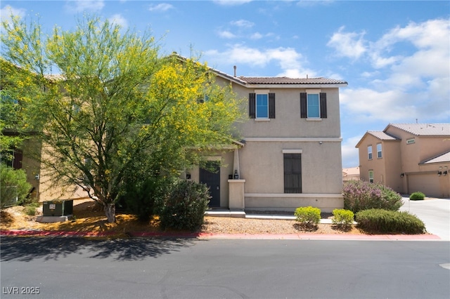 4610 Lime Straight Dr, Las Vegas, NV 89115 - view of front of home featuring stucco siding, concrete driveway, and a tile roof