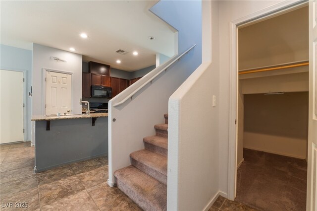 4610 Lime Straight Dr, Las Vegas, NV 89115 - staircase featuring recessed lighting