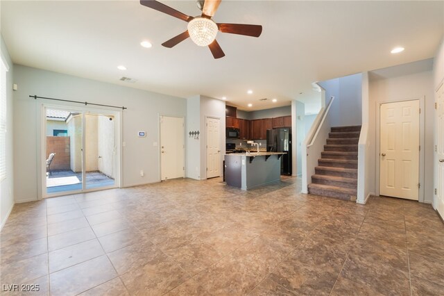 4610 Lime Straight Dr, Las Vegas, NV 89115 - unfurnished living room with ceiling fan, recessed lighting, stairway, and baseboards