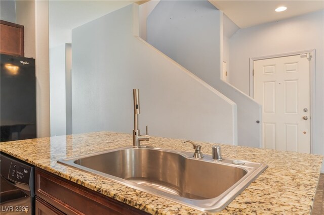 4610 Lime Straight Dr, Las Vegas, NV 89115 - kitchen with a sink, black dishwasher, light stone countertops, and recessed lighting