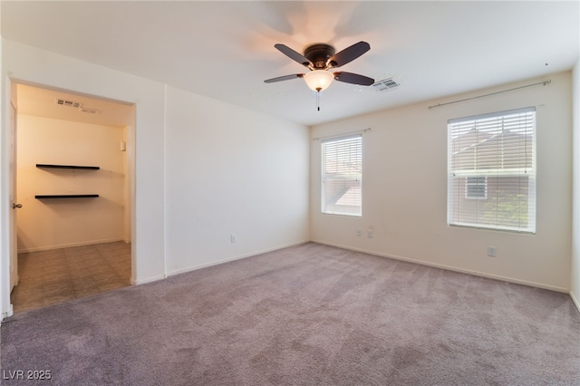 4610 Lime Straight Dr, Las Vegas, NV 89115 - spare room featuring carpet floors, a ceiling fan, and baseboards