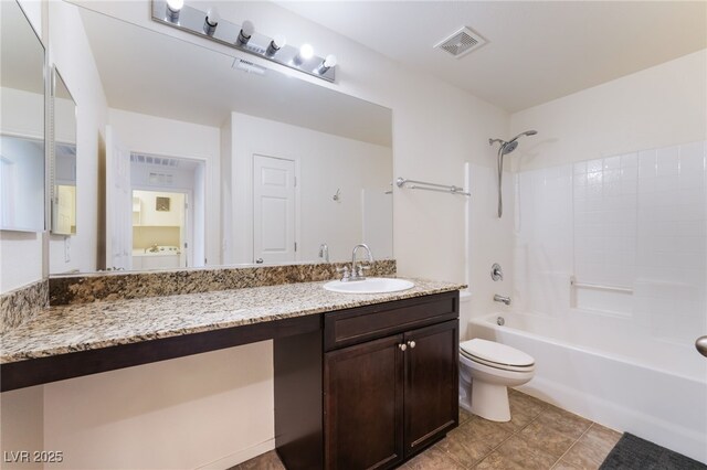4610 Lime Straight Dr, Las Vegas, NV 89115 - full bath featuring vanity,  shower combination, toilet, washer / dryer, and tile patterned floors