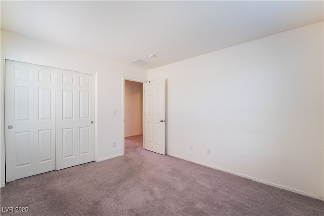 4610 Lime Straight Dr, Las Vegas, NV 89115 - unfurnished bedroom with carpet flooring, a closet, and baseboards