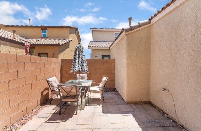 4610 Lime Straight Dr, Las Vegas, NV 89115 - fenced backyard featuring outdoor dining area and a patio