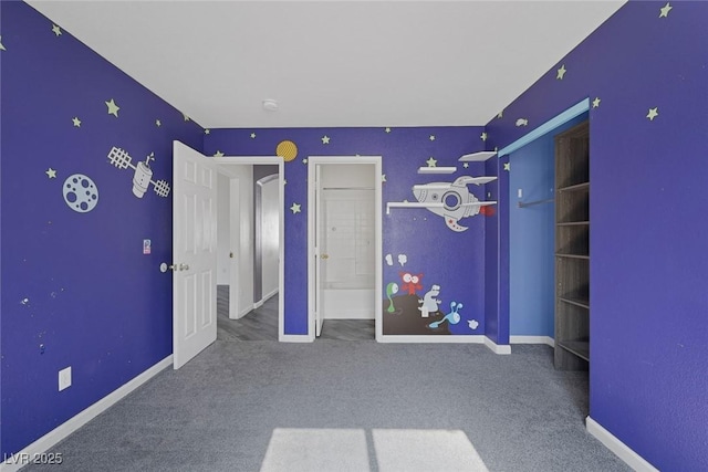 2410 Morocco Ave, North Las Vegas, NV 89031 - unfurnished bedroom featuring carpet and baseboards