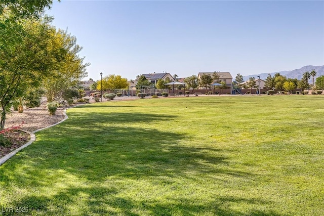 2410 Morocco Ave, North Las Vegas, NV 89031 - view of home's community featuring a lawn and a mountain view