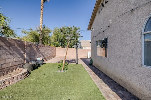 2410 Morocco Ave, North Las Vegas, NV 89031 - view of yard featuring a patio area