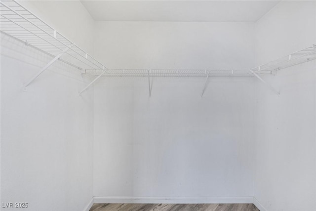 2410 Morocco Ave, North Las Vegas, NV 89031 - spacious closet featuring wood finished floors