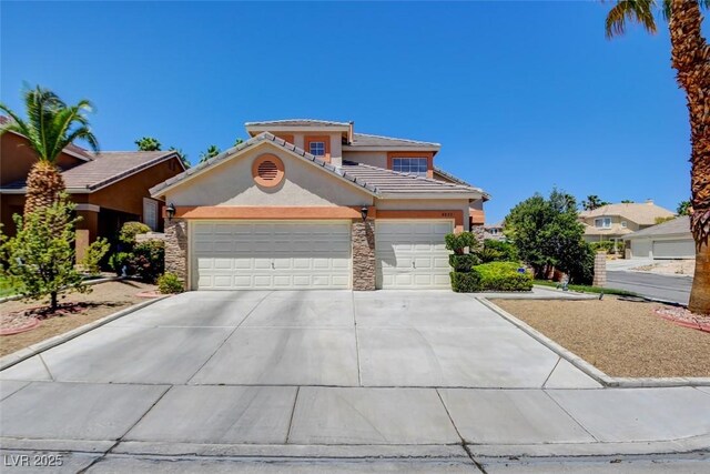 4835 Willow Glen Dr, Las Vegas, NV 89147 - view of front facade featuring stucco siding, concrete driveway, a tile roof, and an attached garage