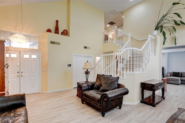 4835 Willow Glen Dr, Las Vegas, NV 89147 - entrance foyer featuring a high ceiling, stairway, wood finished floors, and baseboards