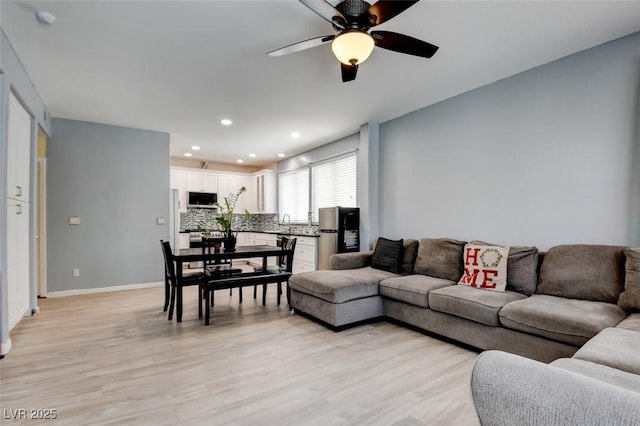 4835 Willow Glen Dr, Las Vegas, NV 89147 - living room featuring a ceiling fan, light wood-style flooring, recessed lighting, and baseboards