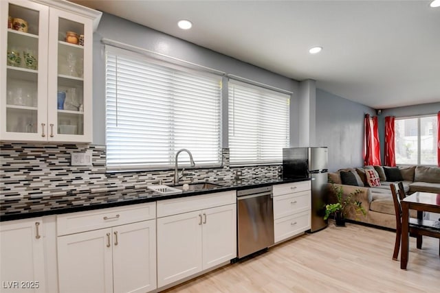 4835 Willow Glen Dr, Las Vegas, NV 89147 - kitchen with stainless steel appliances, dark countertops, decorative backsplash, a sink, and recessed lighting
