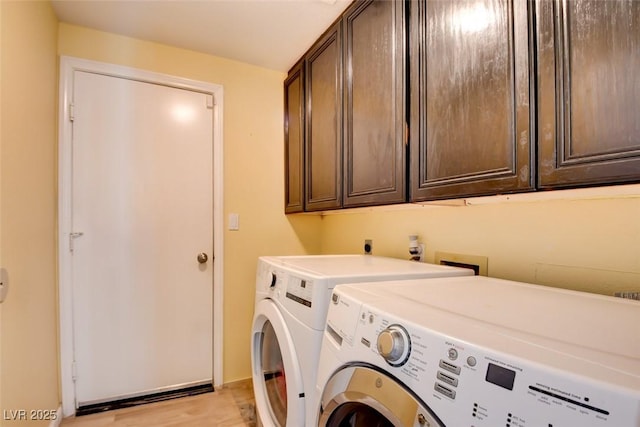 4835 Willow Glen Dr, Las Vegas, NV 89147 - laundry area with cabinet space and washing machine and clothes dryer