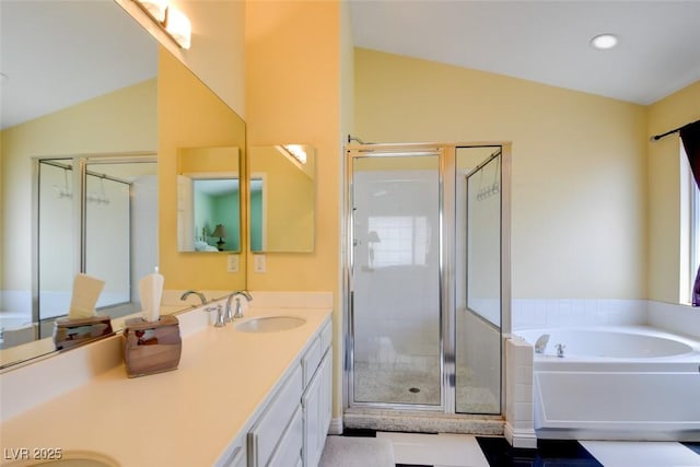 4835 Willow Glen Dr, Las Vegas, NV 89147 - full bathroom with vaulted ceiling, a shower stall, double vanity, a bath, and recessed lighting